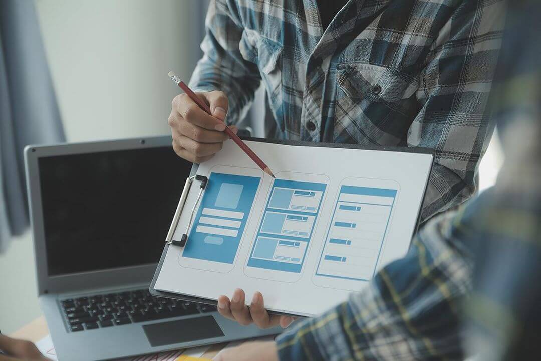A professional designer presenting wireframes of digital  product