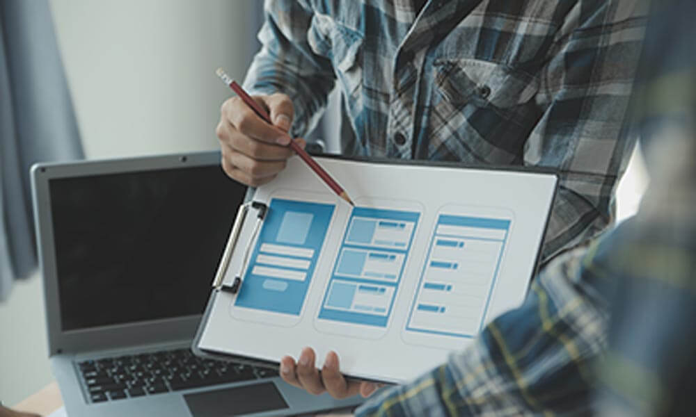 A professional designer presenting wireframes of digital  product